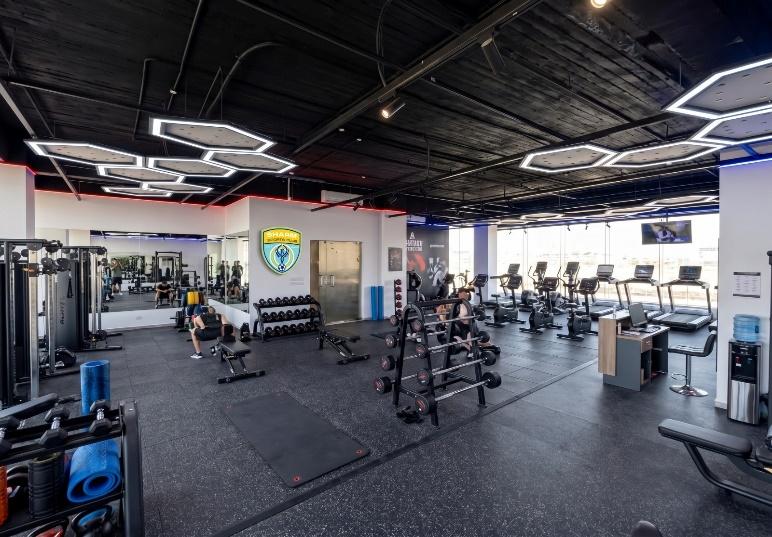 Fully equipped gym with weights and cardio machines at Sharm Sports Club